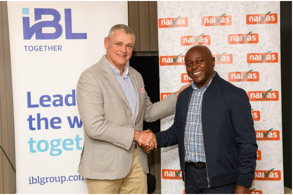 : Handshake between Arnaud Lagesse, IBL Group CEO and David Kimani, Naivas Managing Director